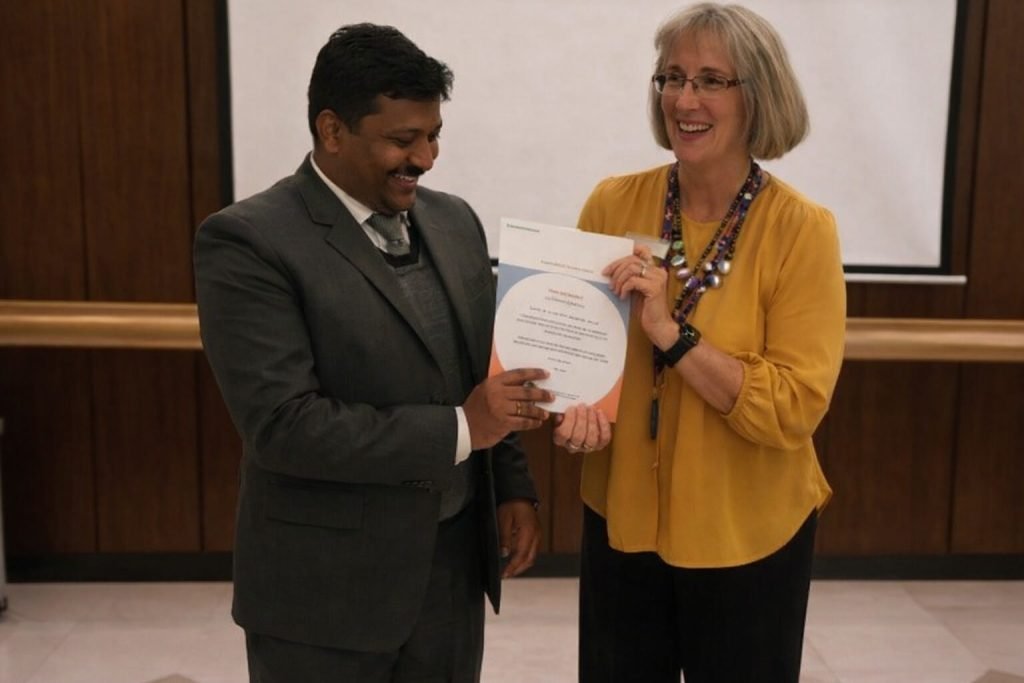 math tutor in conference room receiving award